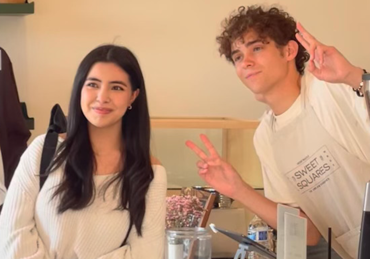 Senior Mei-Ling Leal takes a picture with actor and singer Joshua Bassett on June 16, 2023, while covering an event at Sweet Squares, his sister Ashley Bassett’s bakery.